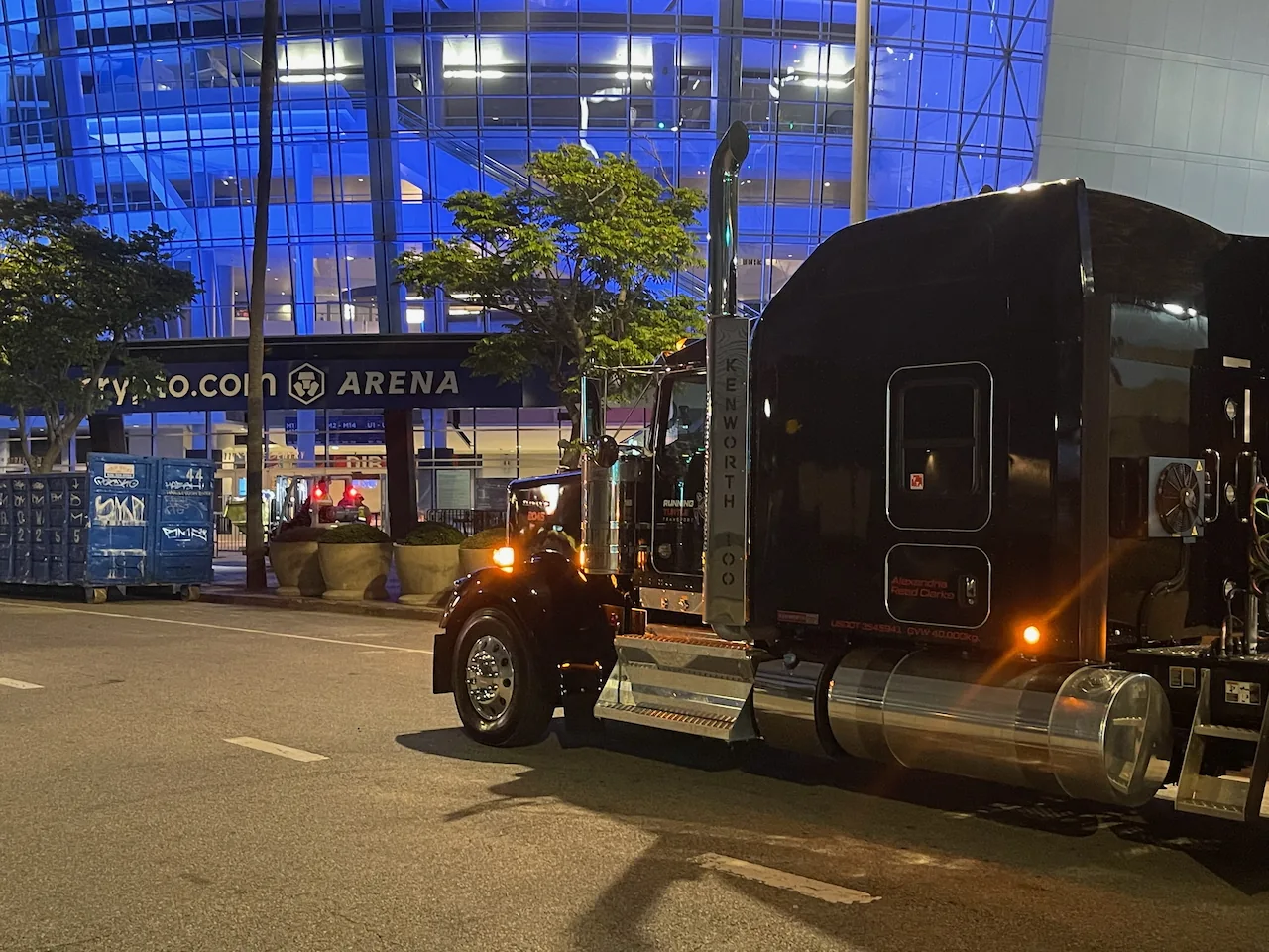 Running Turtle touring truck outside a city arena at night