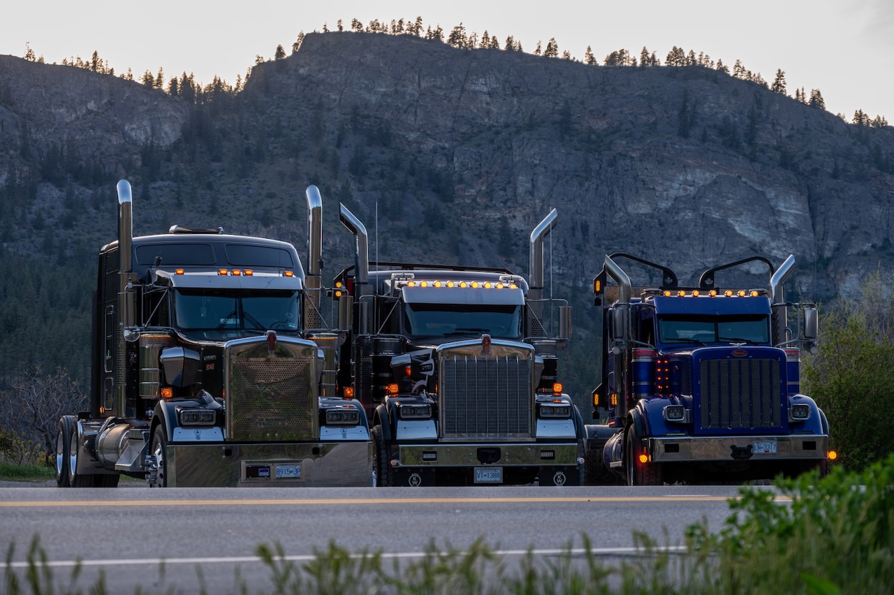 Three Running Turtle tractors lined up against the mountains